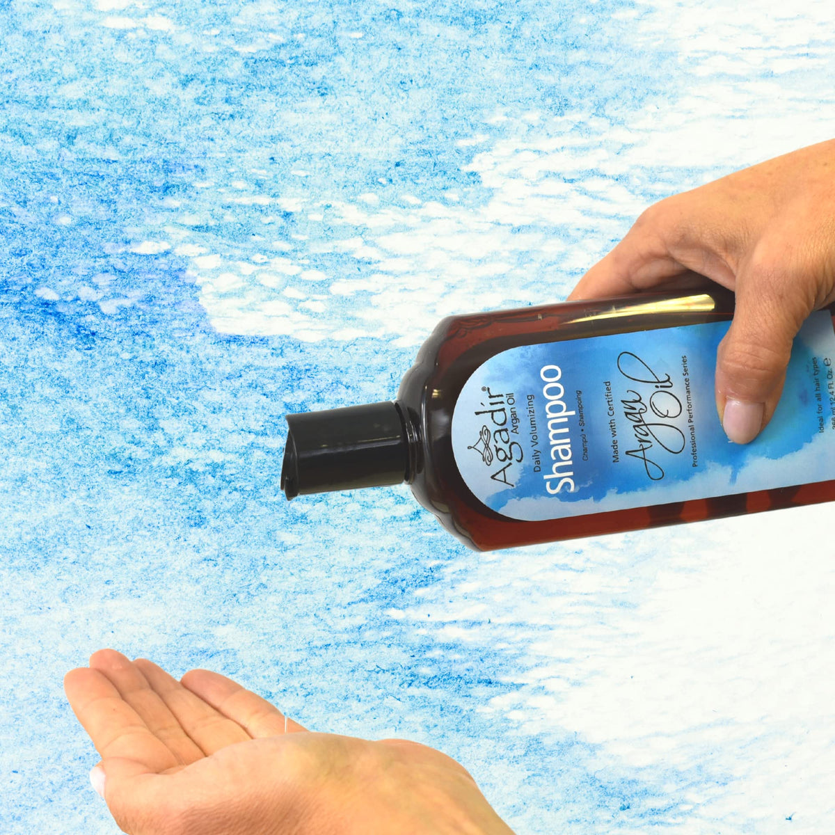 Close-up of Agadir bottle showing argan oil and panthenol infusion for volume.