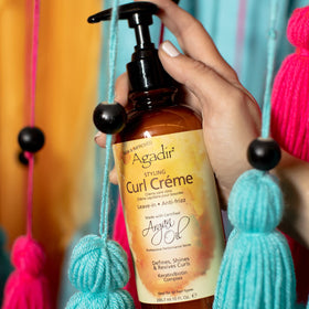 Agadir Styling Curl Creme bottle on counter for easy styling
