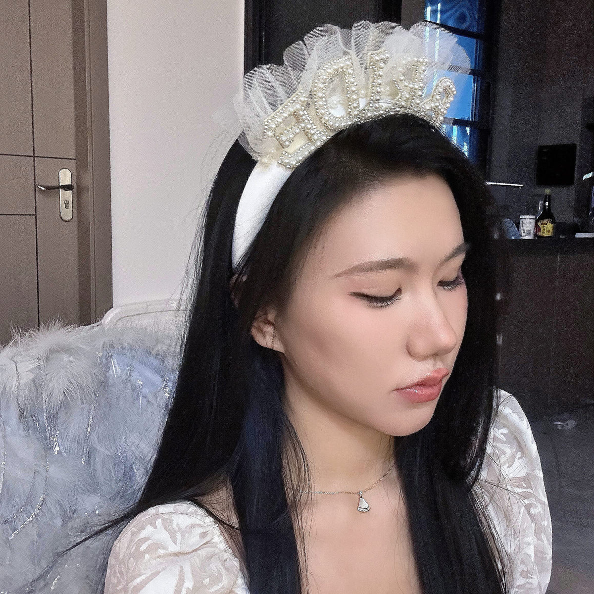 Agkvw Bride headband worn by a bride during a celebration and photos