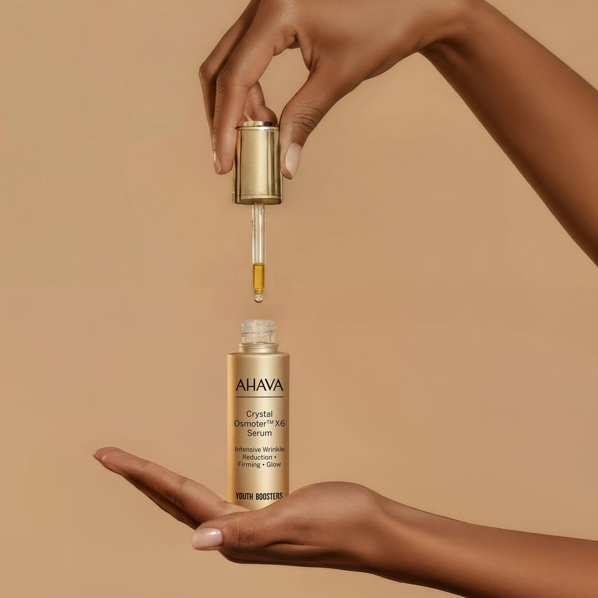AHAVA Crystal Osmoter X6 serum being applied to the face for hydration.