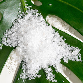 AHAVA Bath Salt dissolving to ease muscle tension during a warm soak.