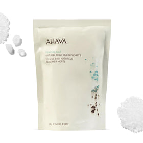 AHAVA Dead Sea Mineral Bath Salt pouring to release minerals for relaxation.