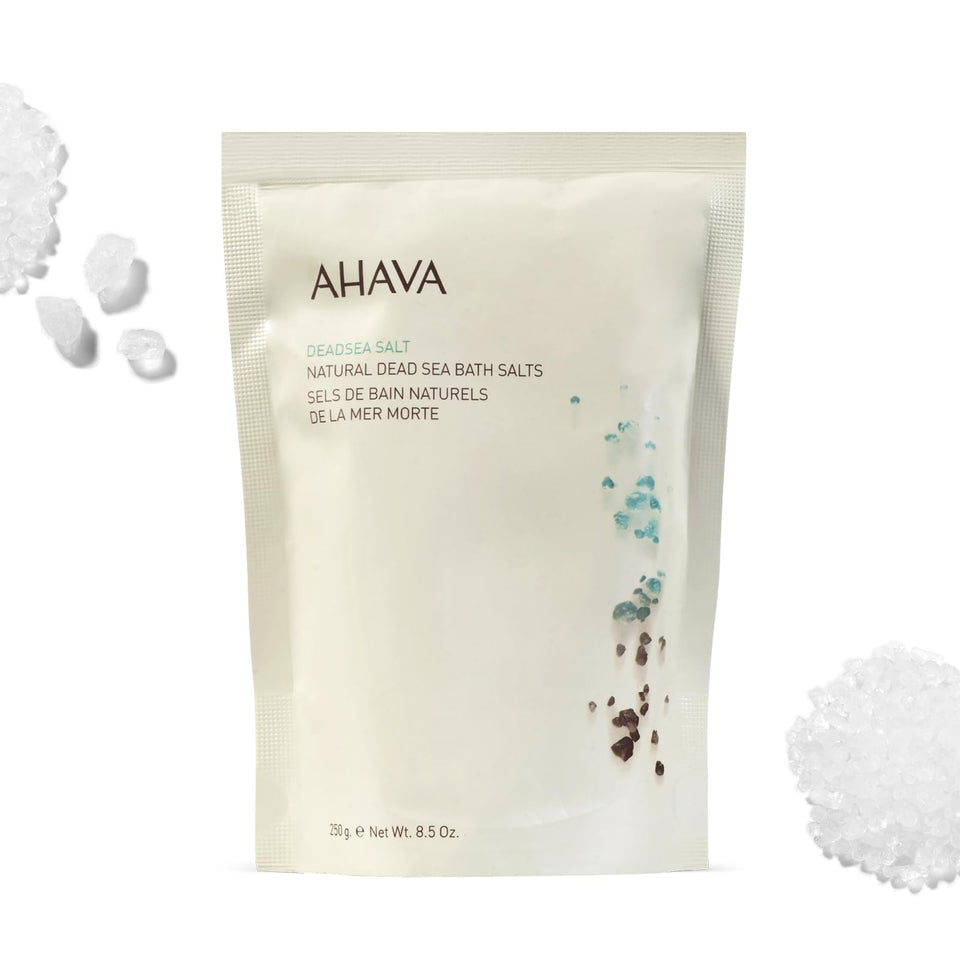 AHAVA Dead Sea Mineral Bath Salt pouring to release minerals for relaxation.