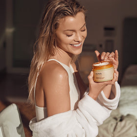 AHAVA hands applying body sorbet to reveal smooth, refreshed skin