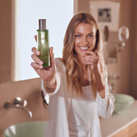 AHAVA Dry Oil Body Mist highlights jojoba seed oil for nourished skin.
