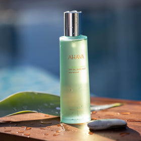 AHAVA Sea-Kissed Dry Oil Body Mist spray application for quick absorption.