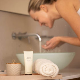 AHAVA gel texture foams on hand, smooth cleansing experience.