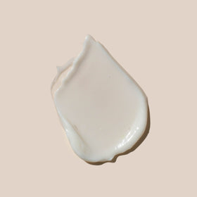 AHAVA moisturizer texture on skin showing silky, quick absorption.