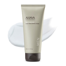 AHAVA Men's Foam-Free Shaving Cream bottle pour showing silky texture for smooth shave.