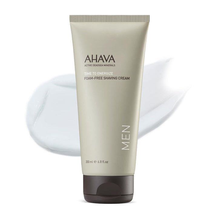 AHAVA Men's Foam-Free Shaving Cream bottle pour showing silky texture for smooth shave.