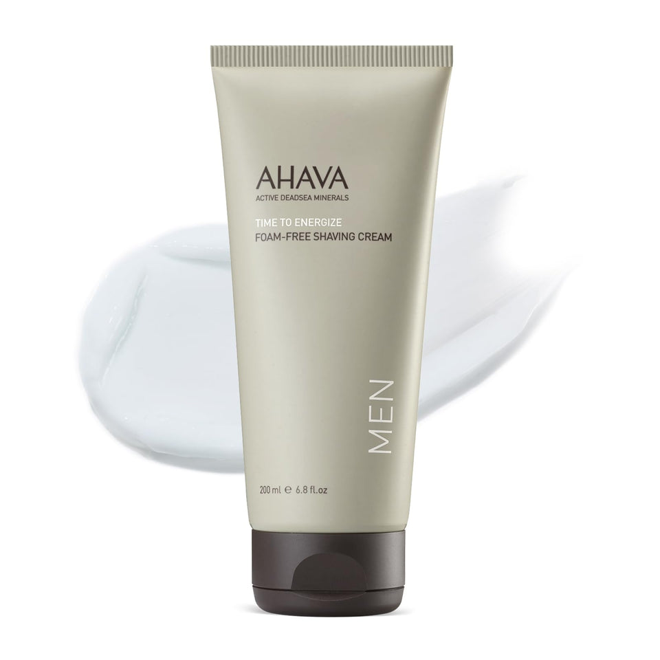 AHAVA Men's Foam-Free Shaving Cream bottle pour showing silky texture for smooth shave.