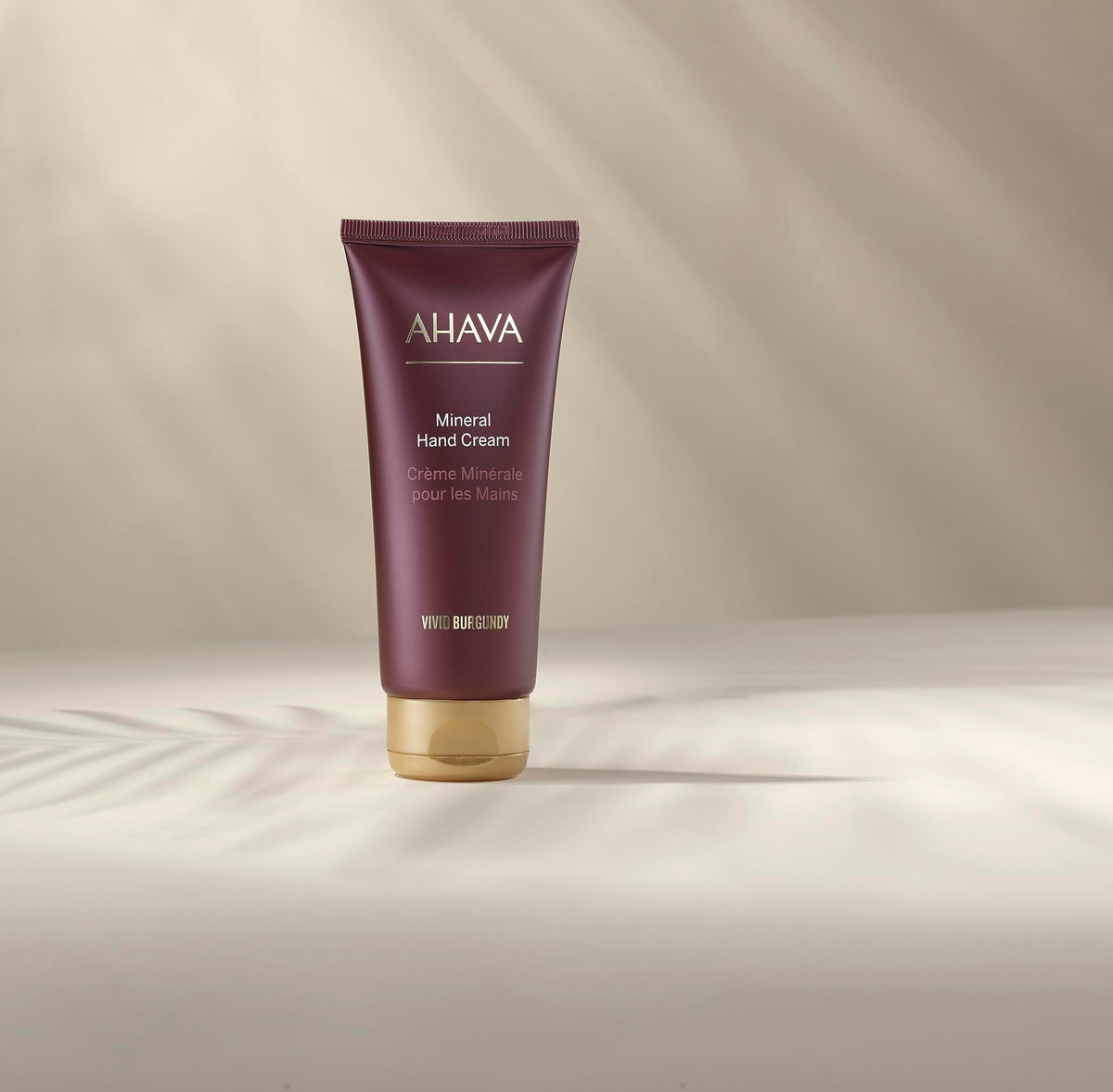 Packaging close-up shows gift-ready design and burgundy accents