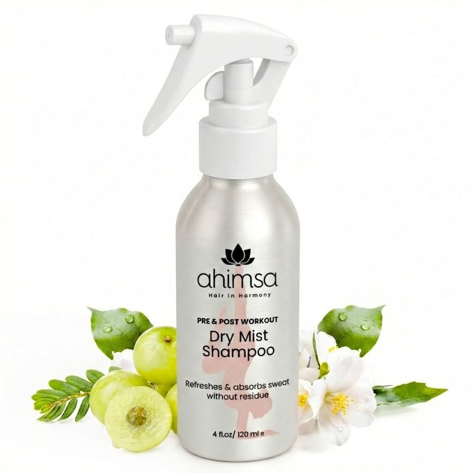 Ahimsa non-aerosol dry shampoo mist bottle close-up for a clean invisible finish on dark hair.