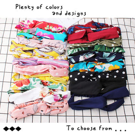 AHONEY knotted-cross elastic headband provides secure, comfortable fit.