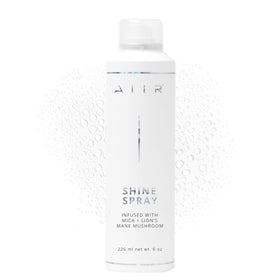 AIIR Shine Spray bottle mist delivering weightless gloss and frizz control.