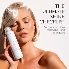 AIIR Shine Spray applied to tame flyaways for a smooth, sleek look.