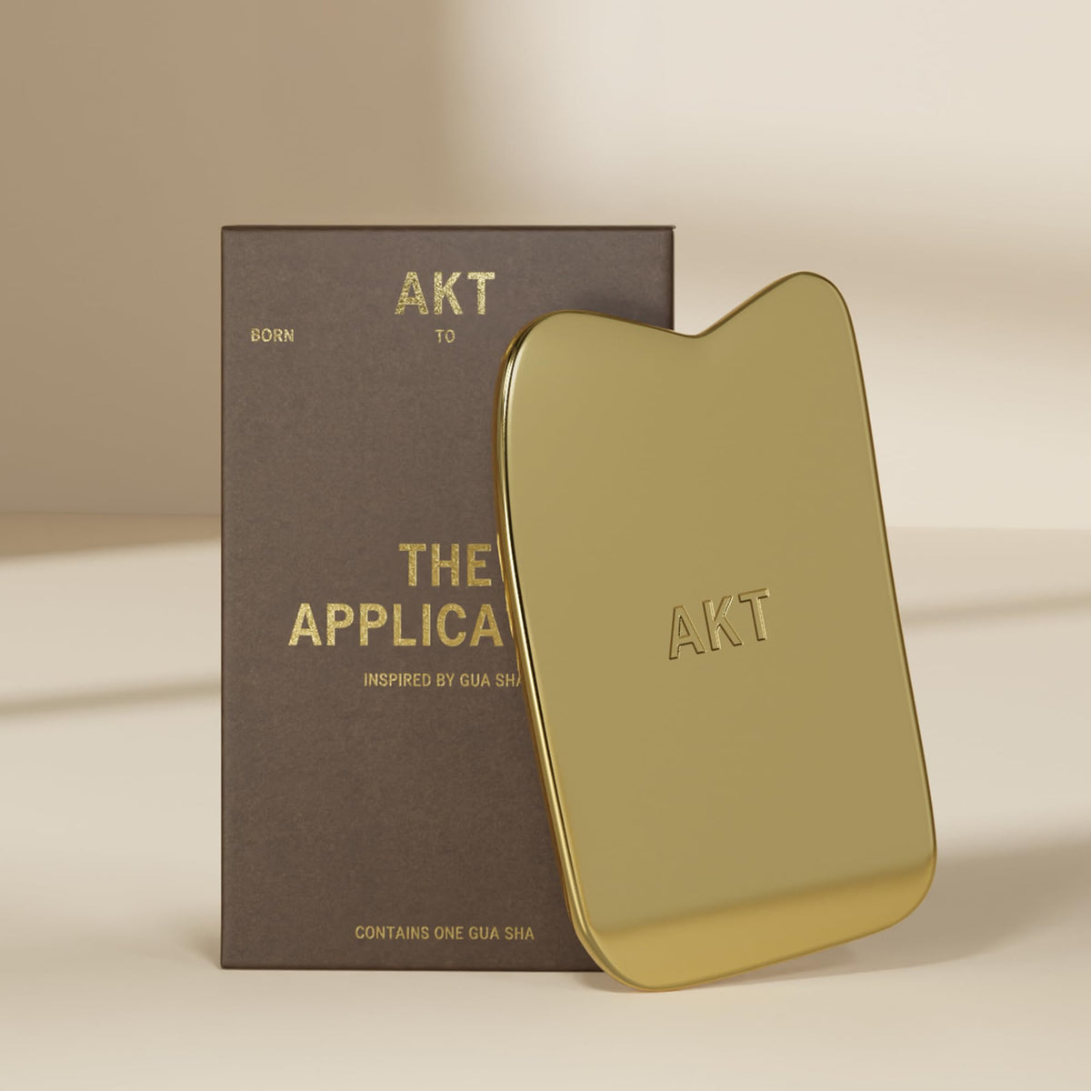 AKT pre-show ritual with gua sha-inspired applicator.
