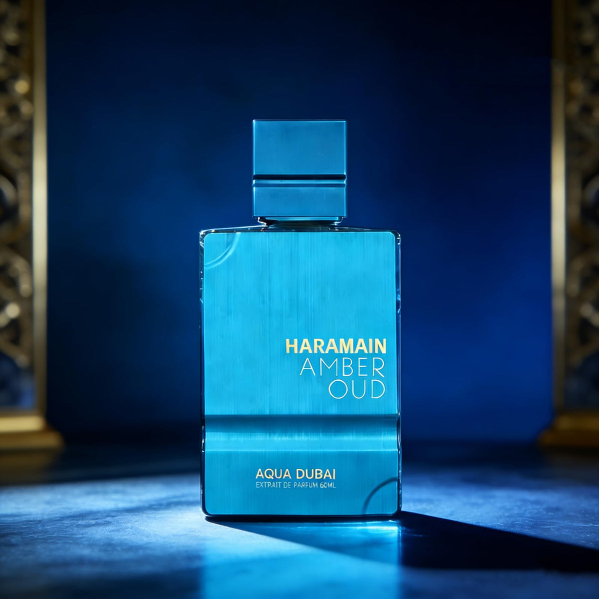 Al Haramain Amber Oud Aqua Dubai bottle resting in velvet display tray for luxury presentation.