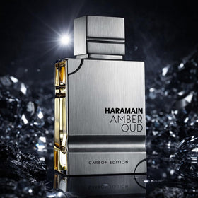 Al Haramain Amber Oud Carbon Edition label detailing heritage and craftsmanship.