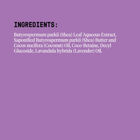Close-up of lavender shampoo foam forming a gentle lather in a bottle.