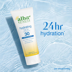 Alba Botanica SPF 30 sunscreen bottle in bright outdoor scene ready for sun.