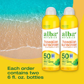 Close up of applying Alba Botanica sunscreen spray outdoors for quick, even coverage