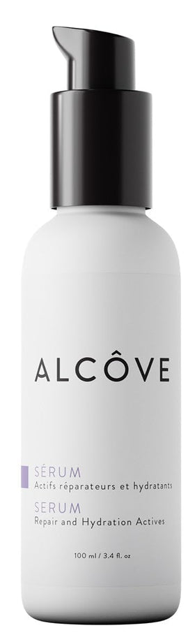 Alcôve Serum bottle with pump delivering smooth, frizz-free results for dry hair.