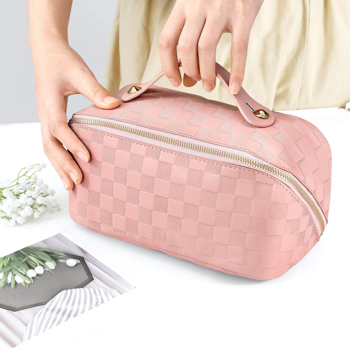 ALEXTINA waterproof makeup bag keeps contents protected in unpredictable weather.