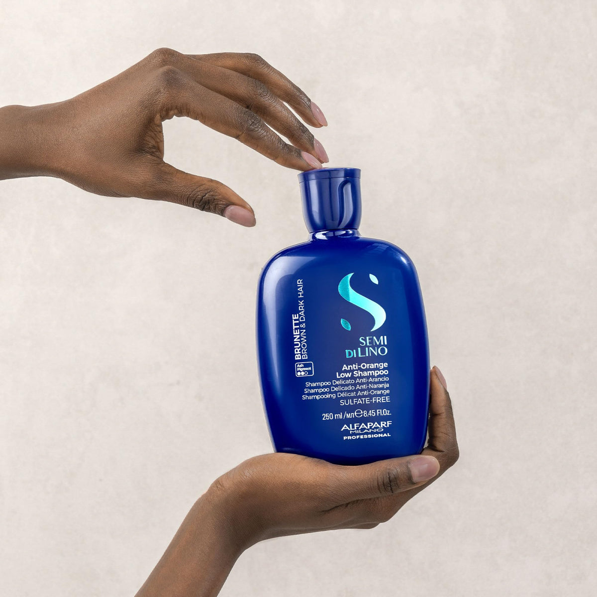 Brunette hair lather from ALFAPARF MILANO Blue Shampoo provides color care.