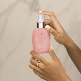 ALFAPARF MILANO detangler spray shown at angle for even distribution.