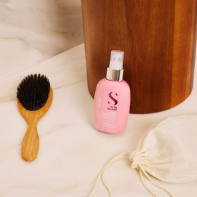 ALFAPARF MILANO detangler spray mist eases knots for smoother brushing.
