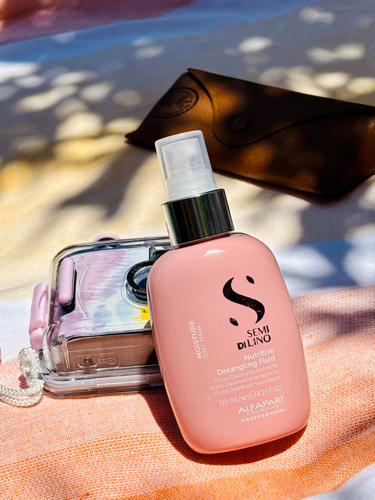 ALFAPARF MILANO bottle-size detangler keeps hair hydrated.
