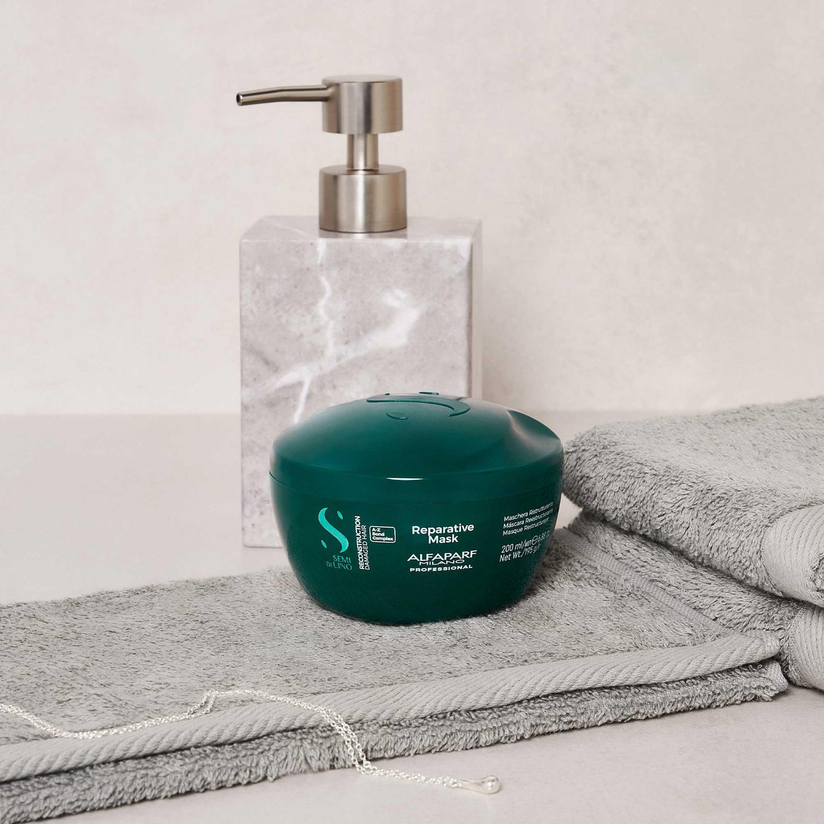 ALFAPARF Milano Reconstruction Mask cream texture highlighting soft, manageable hair.