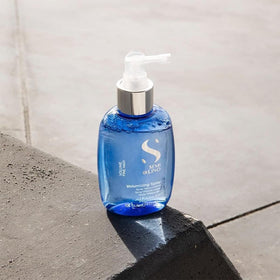 ALFAPARF MILANO Semi di Lino Volume Spray in use showing frizz control and polish