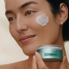 Swatch of Algenist Genius Ultimate Anti-Aging Cream on skin revealing radiant finish