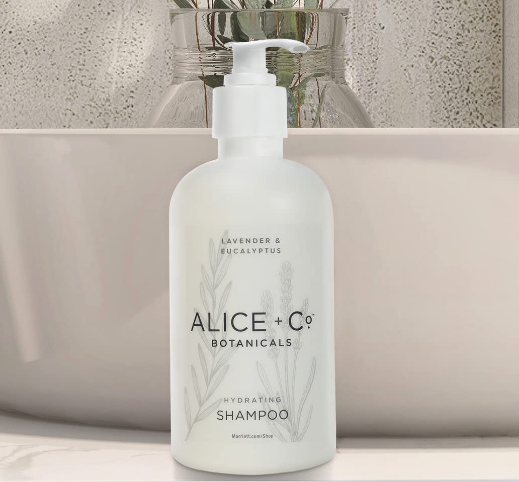 Alice + Co. two bottles on a bathroom sink.