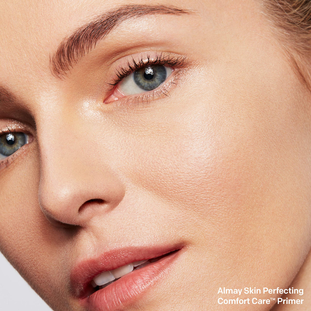 Swatch of Almay primer on skin illustrating smoothing texture and tone balance