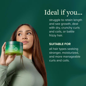 ALODIA Butter Crème applied on wet hair for even distribution and definition.