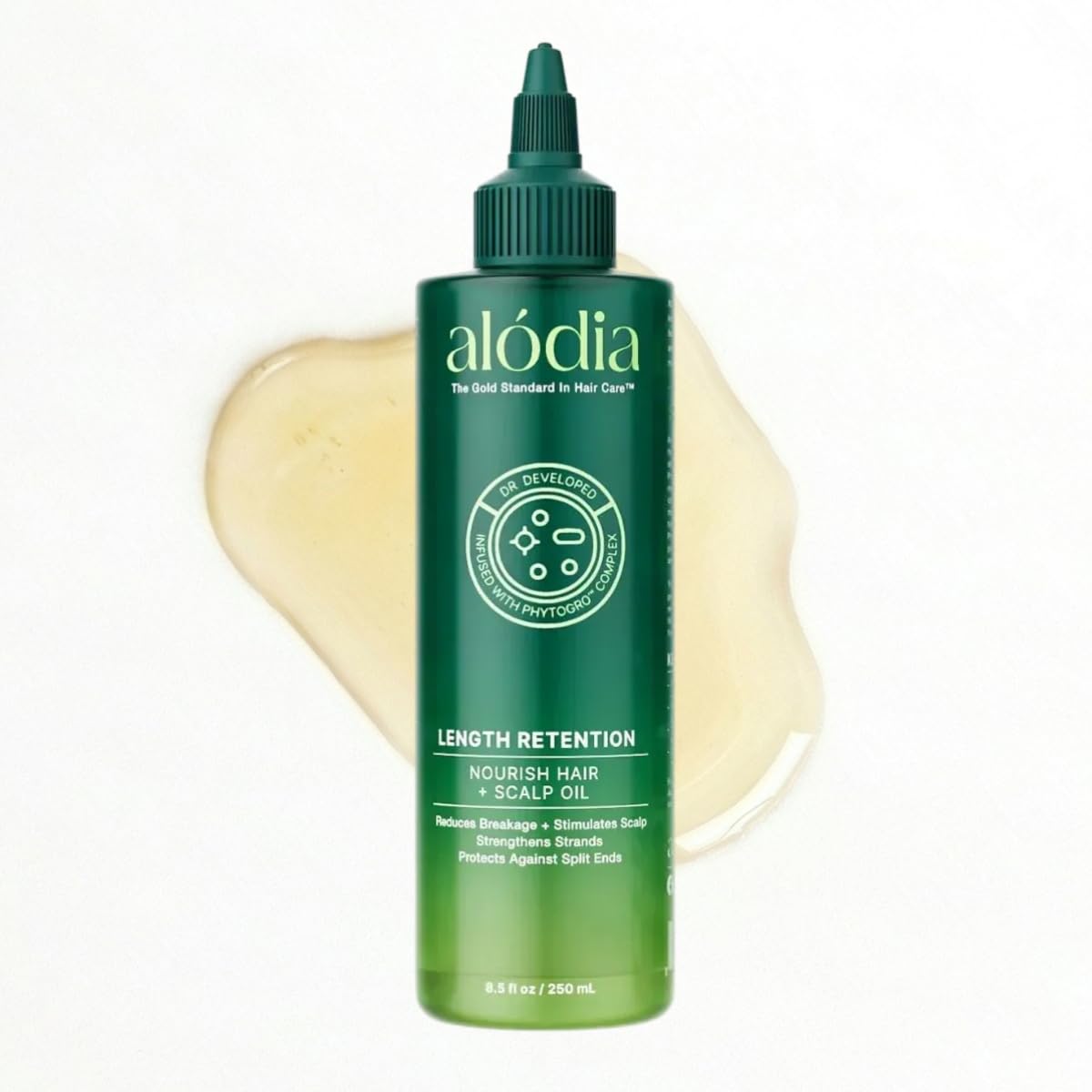 ALODIA Nourish & Grow avocado oil bottle pour for easy pre-shampoo application.