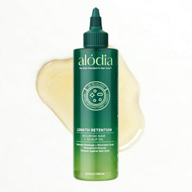 ALODIA Nourish & Grow avocado oil bottle pour for easy pre-shampoo application.