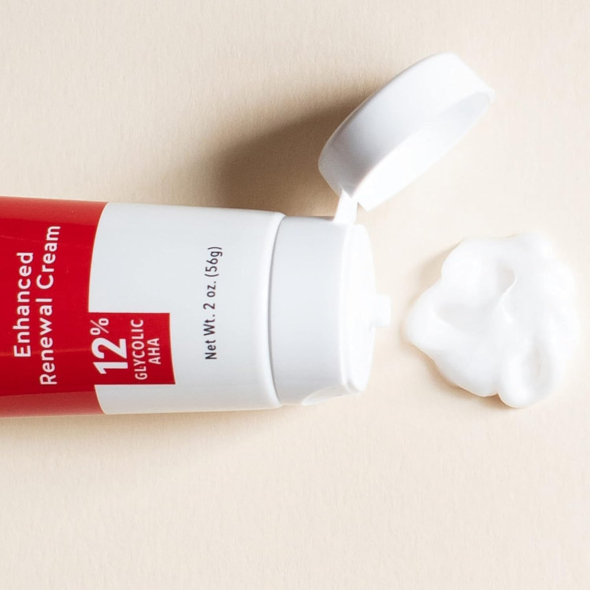 Alpha Skin Care Enhanced Renewal Cream application dots on skin illustrate smooth, even coverage.