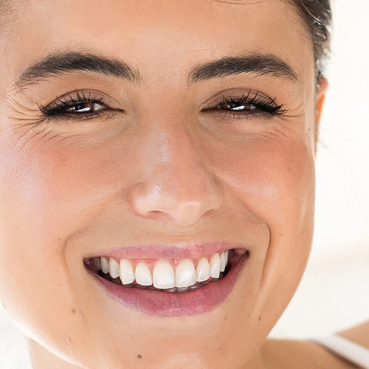 Ingredients highlight on Alpha Skin Care bottle features hyaluronic acid and vitamins.