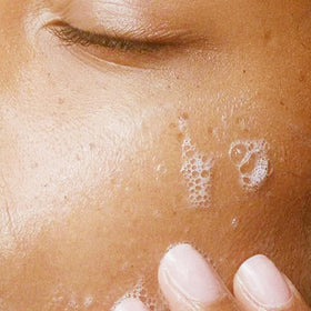 Alpha Skin Care Refreshing Face Wash foaming on hand highlights a light, soap-free cleanse.