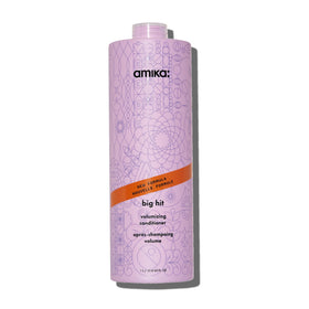Amika Big Hit bottle front view highlighting volumizing formula for fuller-looking hair.