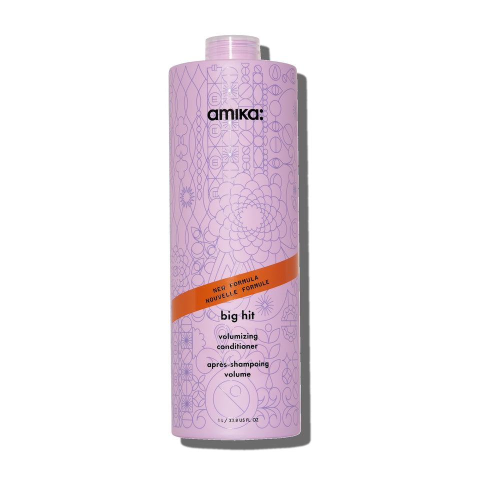 Amika Big Hit bottle front view highlighting volumizing formula for fuller-looking hair.