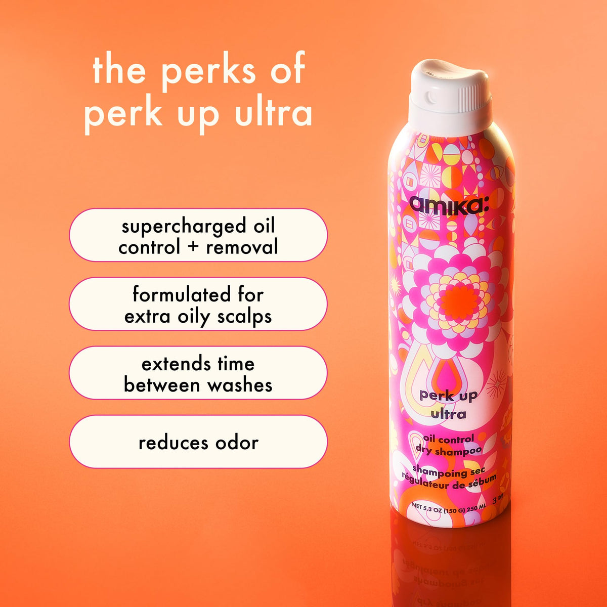 Amika dry shampoo spray nozzle dispensing powder to revive day-old hair.