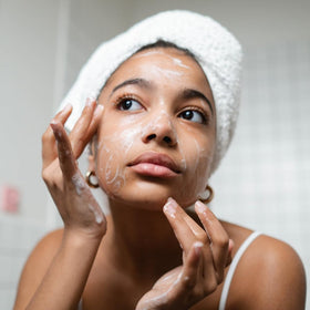 Ammoya Naturals Turmeric Soap product shot emphasizing natural ingredients and glow.
