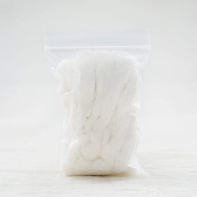 AMOZA organic cotton sliver 13ft pack in hand demonstrates generous quantity for larger projects
