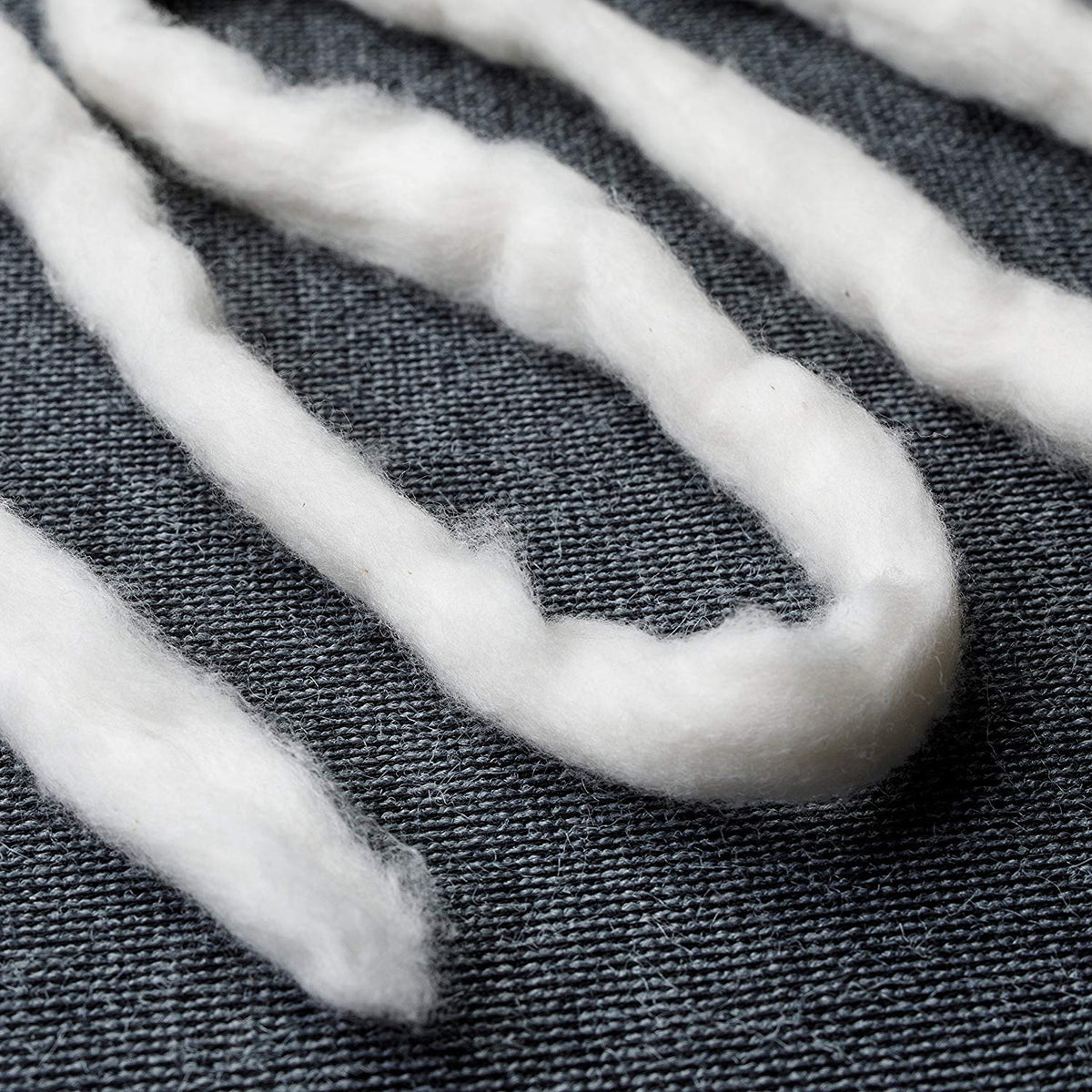 AMOZA 13ft cotton sliver pack beside sewing tools for scale and inspiration