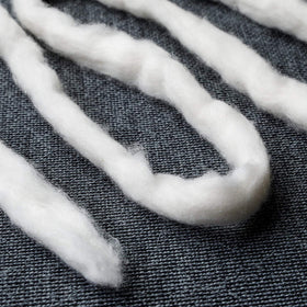 AMOZA 13ft cotton sliver pack beside sewing tools for scale and inspiration